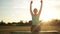 Fitness woman exercising yoga poses at sunset