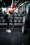 Fitness woman getting ready for high intensity training, workout, working out with barbell for back exercises and triceps