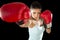 Fitness woman with girl red boxing gloves posing in defiant and competitive fight attitude