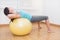 Fitness woman in gym on pilates ball. Young woman doing exercise on fitness ball.