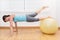 Fitness woman in gym on pilates ball. Young woman doing exercise on fitness ball.