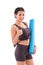 Fitness woman with hand holding yoga mat, giving thumb up