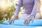 Fitness, woman and hands with yoga mat for spiritual wellness, zen workout or pilates in nature. Closeup of female yogi