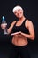 Fitness woman holding bottle