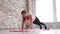 Fitness woman is holding plank.