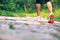 Fitness woman legs hiking on trail