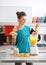 Fitness woman making pumpkin smoothie in kitchen