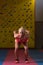 Fitness Woman Performing a Long Jump In Gym