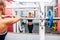 Fitness woman preparing barbell squats in a gym