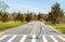 Fitness woman running on crosswalk