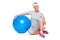 Fitness woman sitting near blue ball