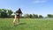 Fitness woman in sportswear doing various exercises on green grass of sports field, at stadium. Outdoor sports. online