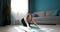 Fitness woman stretching body on yoga mat