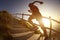 Fitness woman trail runner running on seaside mountain stairs