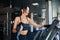 Fitness woman training on treadmill.