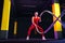 Fitness woman using training ropes for exercise at gym. Athlete working out with battle ropes at cross gym