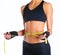 Fitness womans beautiful body with measure tape