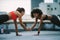 Fitness women doing push ups together on rooftop