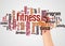 Fitness word cloud and hand with marker concept