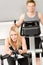 Fitness young girl on gym bike