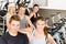 Fitness young group people at gym bicycle