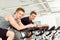 Fitness young man on gym bike spinning