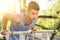 Fitness young man training on parallel crossbars