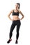 Fitness young pretty woman in black leggings and tank top posing with hands on hips