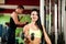 Fitness youple workout - fit mann and woman train in gym