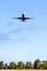 Fiumicino, Italy. Bottom view of airplane flying above the fields near airport Rome-Fiumicino