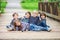 Five adorable kids, dressed in striped shirts, hugging and smiling