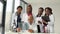 Five african american doctors man and women examine an x-ray while standing at a table