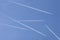 Five aircrafts in the ski make a graphic sign with condensation trails with copy space for your text