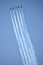 Five blue angel jets flying upward in sync