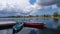 Five boats reflecting on a lake of Belitong.