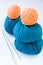 Five bright balls of yarn and knitting needles