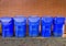 Five Bright Blue Recycle Bins