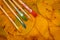 Five brushes for painting on colorful autumn leaves background