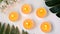 Five burning candles on white background top view