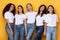 Five Cheerful Young Ladies Posing On Yellow Background, Studio Shot