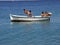 Five children in fun on boat at sea