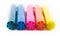 Five colorful pens on a white background - yellow, pink, orange, green and blue