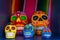 Five colorful skulls from Mexican tradition