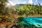 The Five Coloured Pool with azure water among mountains