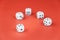 five dice lie on a red background