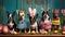 Five dogs in costumes sitting in a row with Easter eggs and decorations on a turquoise background