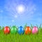 Five Easter eggs on the grass under the sky
