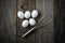 Five Eggs and Whisk or Egg Beater on Rustic Wood