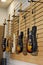 Five electric guitars hanging on display rack in store for sale