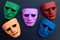 Five face masks on dark background